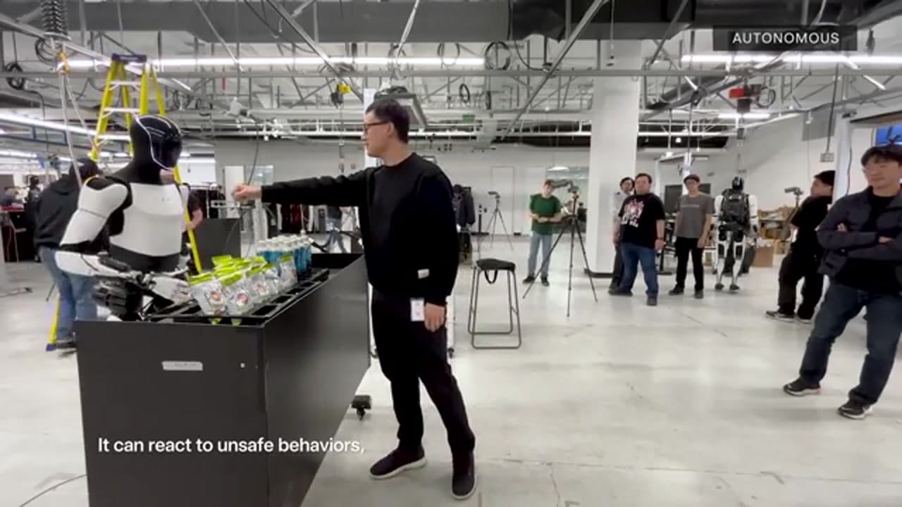 Tesla Optimus handling items during an autonomous demo